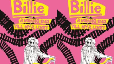 Billie på en cykel med tågspår i bakgrunden.