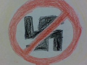 Målad symbol för att stoppa rasismen.